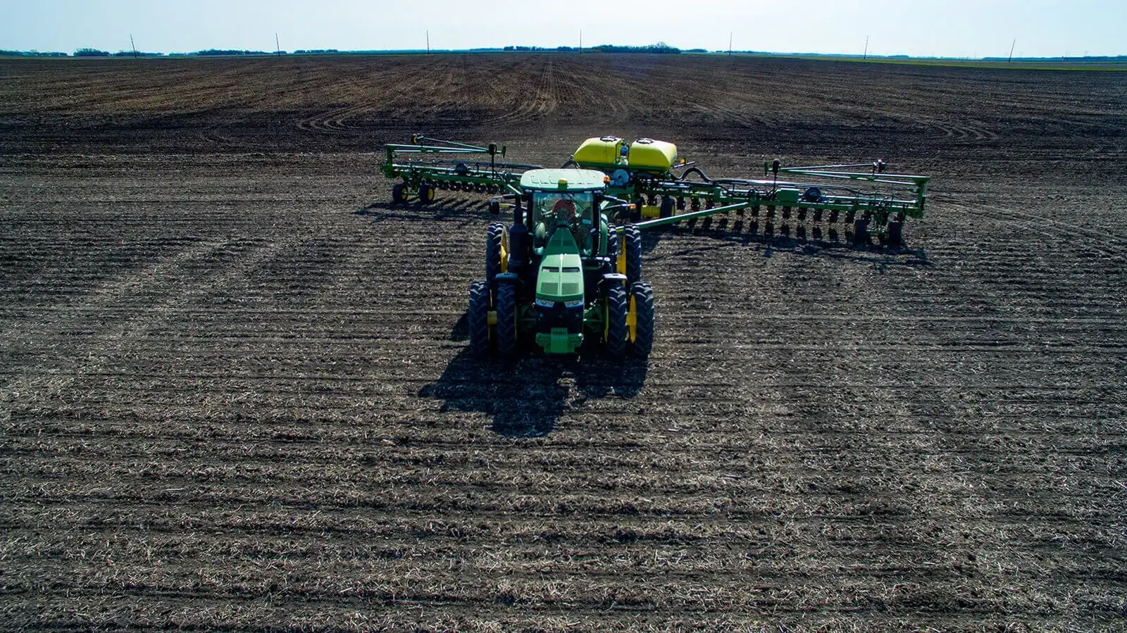 tractor pulling tillage equipment in a field